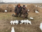 Two hunters with smoe snow geese